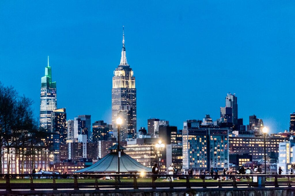 Empire State Building lit against the twilight sky